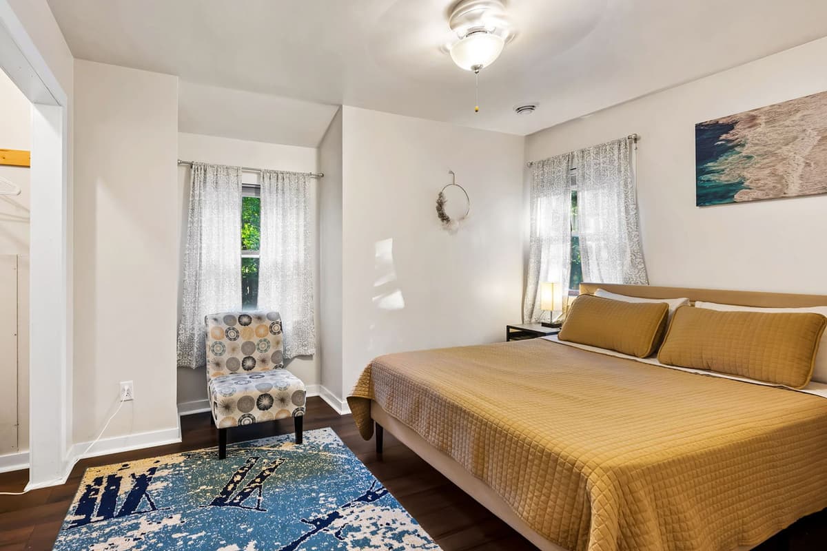 Settle in for a restful stay in the inviting queen bedroom, designed with comfort in mind.