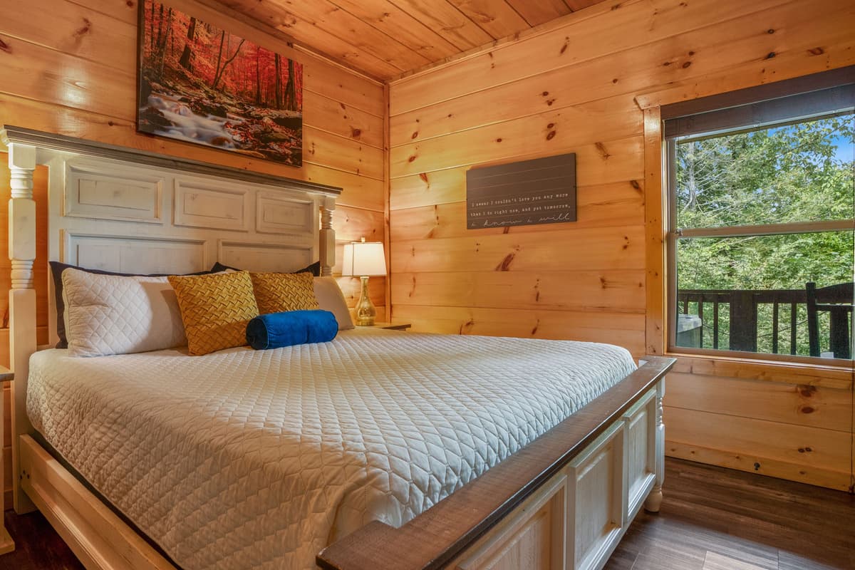 Unwind in another beautifully appointed king bedroom, offering a comfortable retreat after a day of Smoky Mountain adventures.