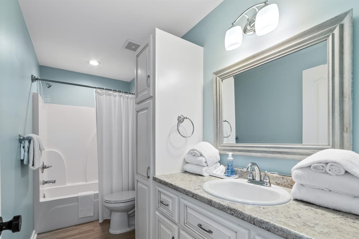 Enjoy a freshly-cleaned beach getaway bathroom with all of the amenities.