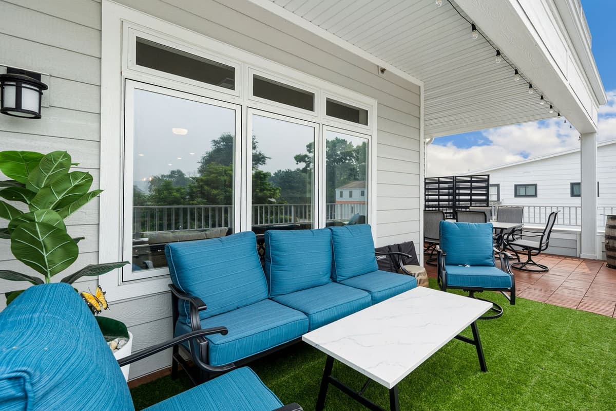 Step out onto the deck and relax on the comfortable outdoor sofa. It’s a welcoming spot to enjoy the fresh air, take in the peaceful surroundings, and spend time together.