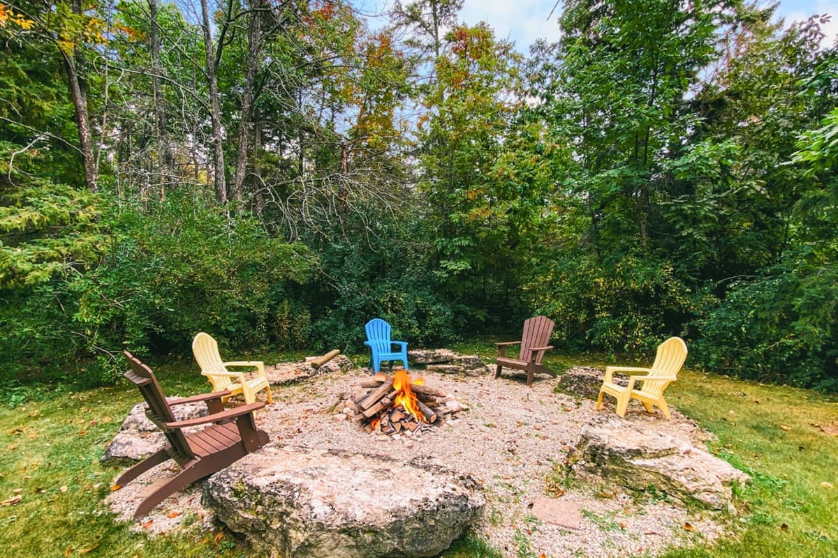 Gather around the backyard firepit for cozy evenings under the stars.