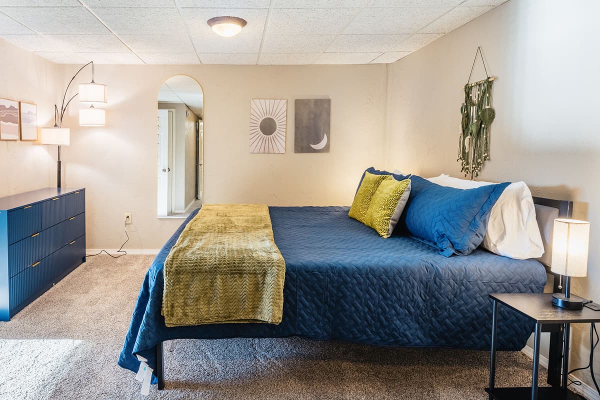 The lower-level king bedroom offers a comfortable and peaceful space to settle in during your stay. A spacious king bed provides plenty of room for a restful night's sleep.