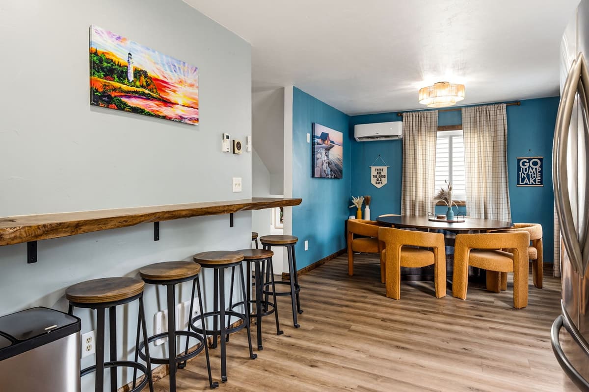 The inviting setup is conveniently located within the open-concept kitchen and dining area on the main level.