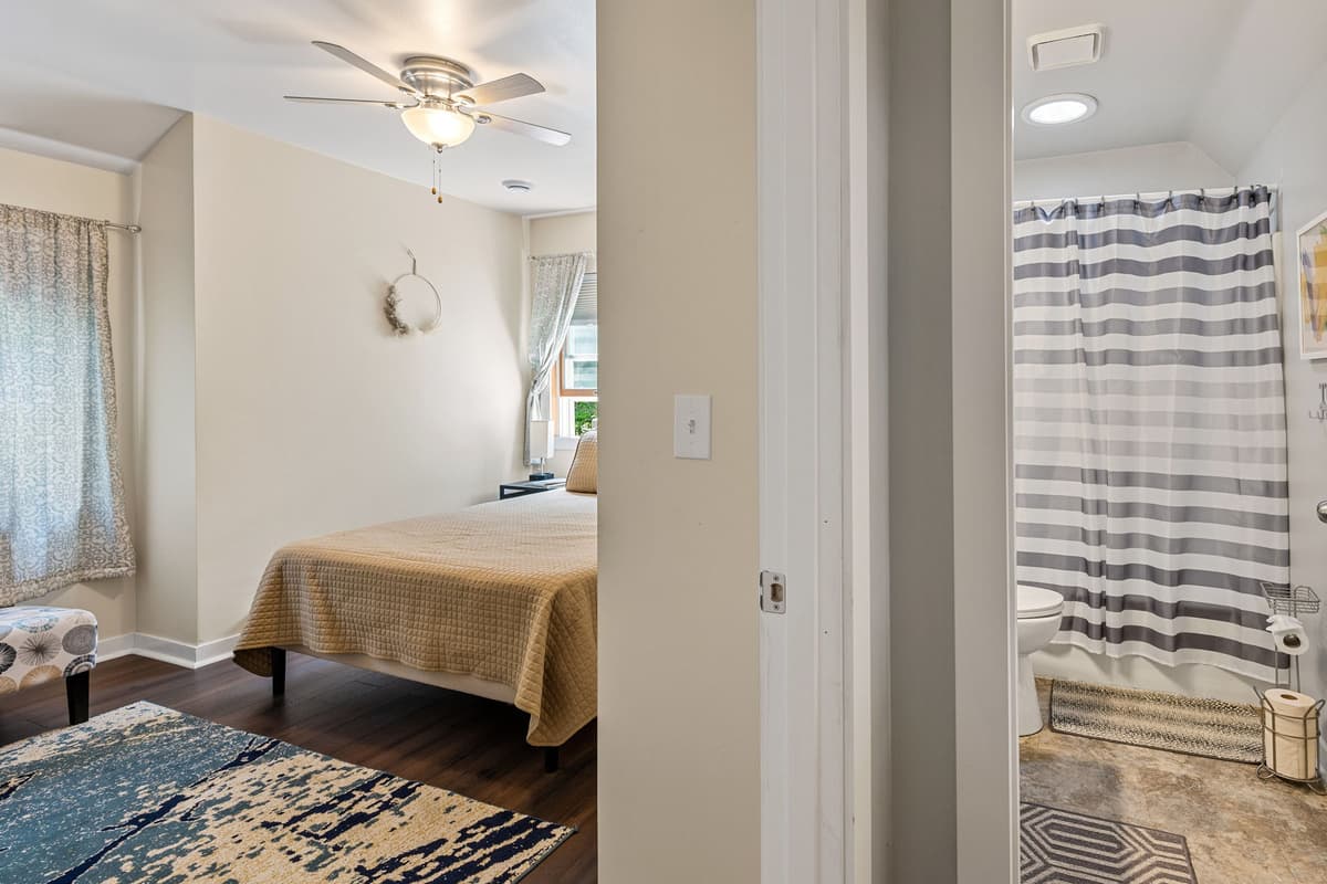 Enjoy the convenience of a bathroom just steps from the queen bedroom, offering easy access for getting ready in the morning or winding down after a day of exploring.