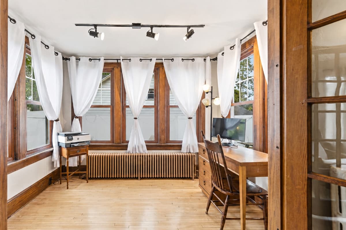 Brighten your stay in the inviting sunroom, a peaceful space designed for both relaxation and productivity. The comfortable working desk provides a convenient spot to catch up on emails, work remotely, or plan your day.