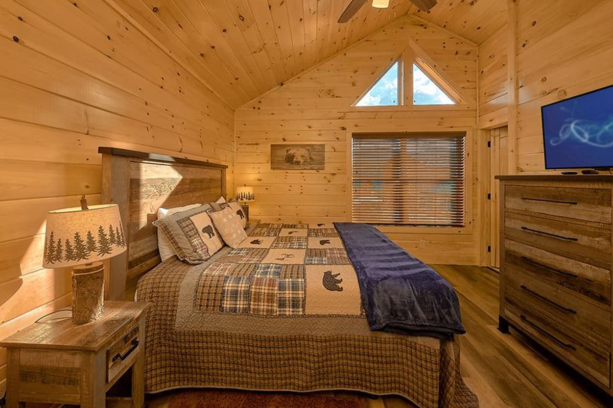 Enjoy another peaceful retreat in this comfortable king bedroom. The spacious king bed offers a cozy place to rest and recharge during your Smoky Mountain getaway. Warm details and a welcoming atmosphere make it easy to feel right at home.
