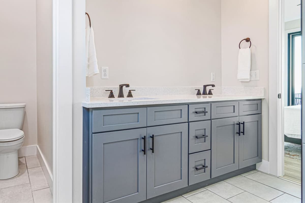 Enjoy the convenience of a spacious full bathroom featuring two separate vanities.