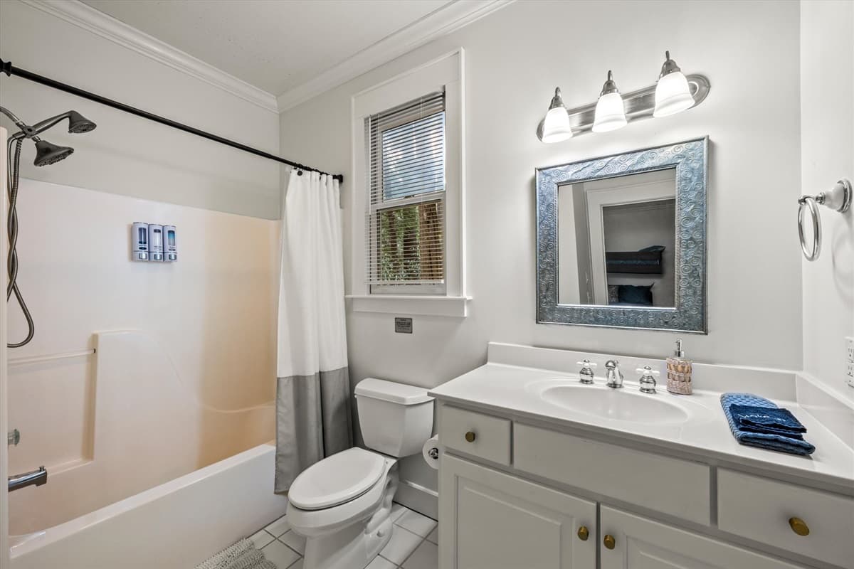 Bathroom 2 with Shower and Tub Combo, Toilet, Vanity and Ornate Mirror