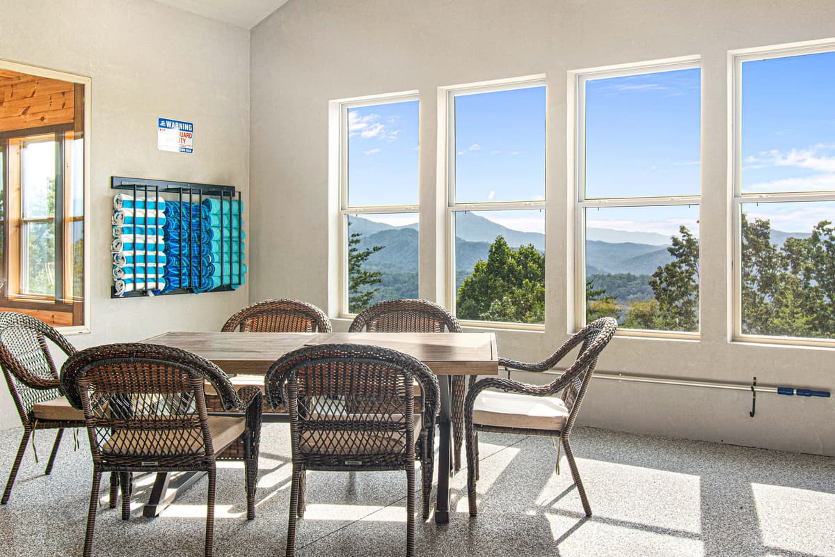 A table in the pool room adds extra space to gather, relax, and enjoy some downtime between dips in the heated pool.
