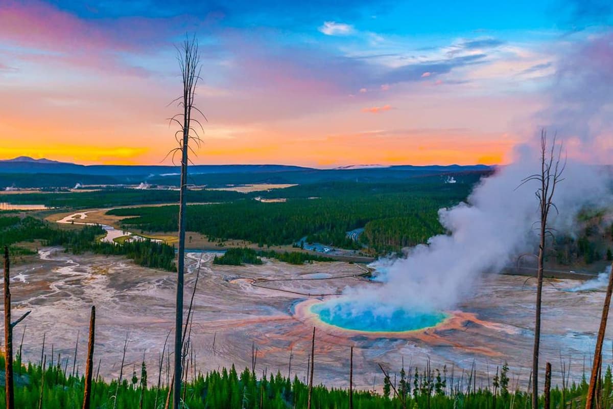 Make your Cody, Wyoming getaway even more unforgettable with a visit to the iconic Old Faithful Geyser in Yellowstone National Park.