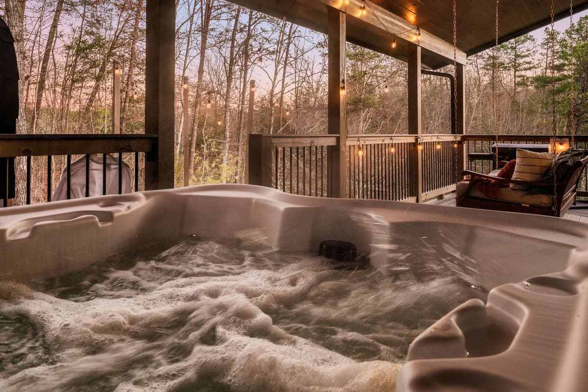 Relax and soak in the private hot tub at Falcon Crest, surrounded by the peaceful beauty of the Smoky Mountains.