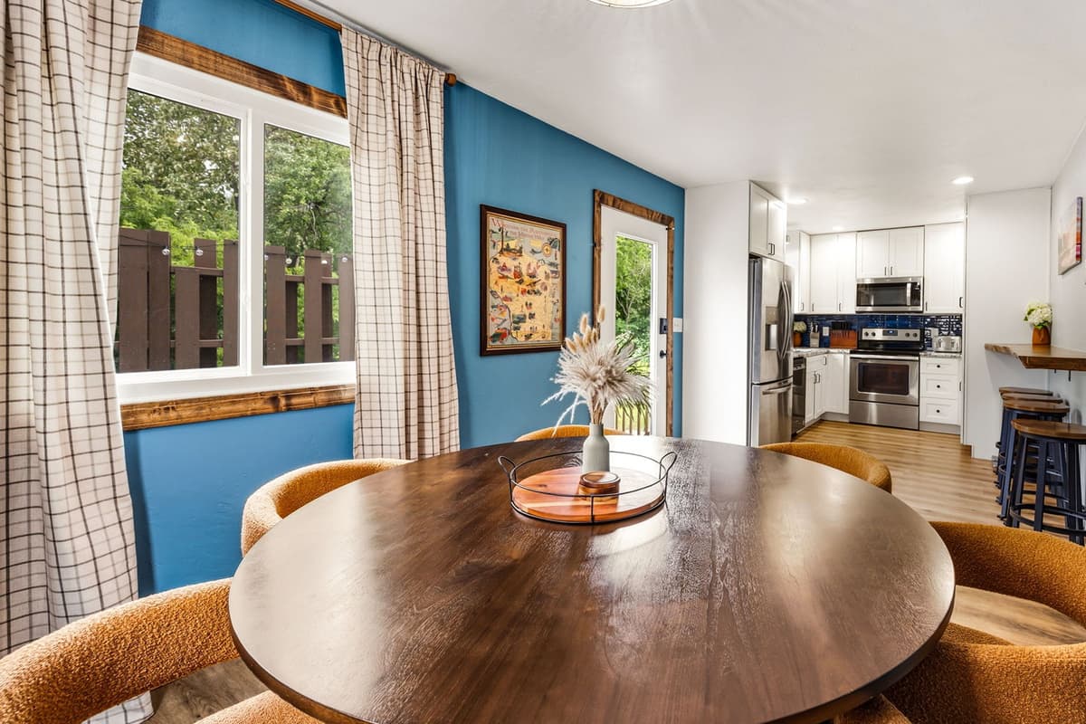 Gather around the round dining table for shared meals, morning coffee, and relaxed conversations during your stay.
