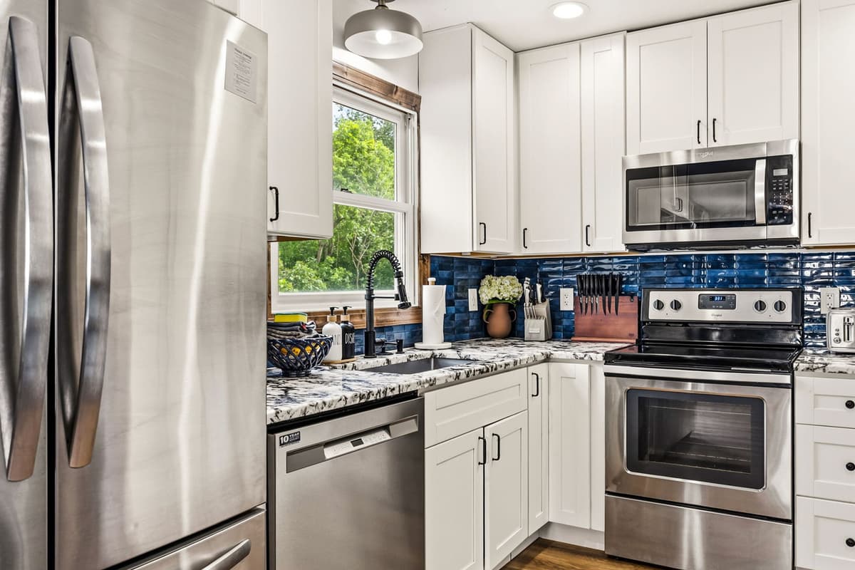 Stainless steel appliances provide a modern and functional space for cooking.