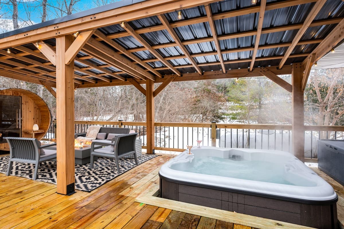 Soak your cares away in the 5-person hot tub, reset in the cozy barrel sauna, or gather around the fire table under the pergola, where the stars create a perfect backdrop for evening conversations.