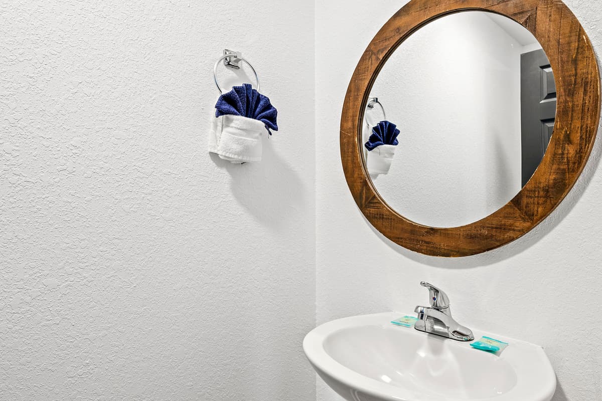 Enjoy the convenience of an additional half bathroom, perfect for guests needing a quick refresh.