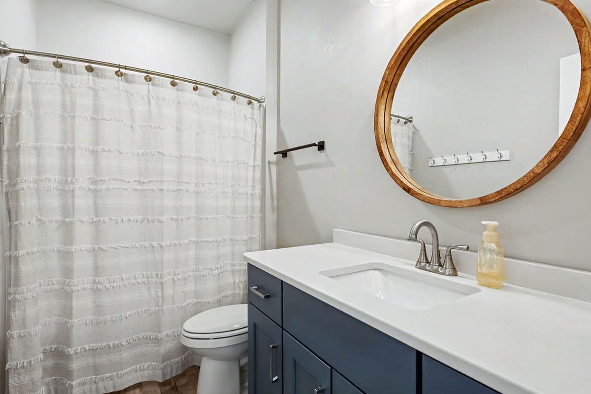 The bathroom is conveniently located for easy access throughout the home. Guests will appreciate having a dedicated space to get ready without feeling rushed.