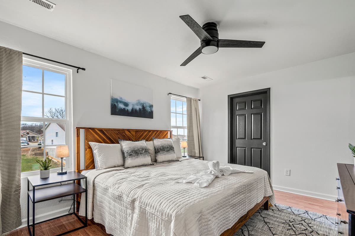Rest easy in the spacious king bedroom, designed with comfort and relaxation in mind.