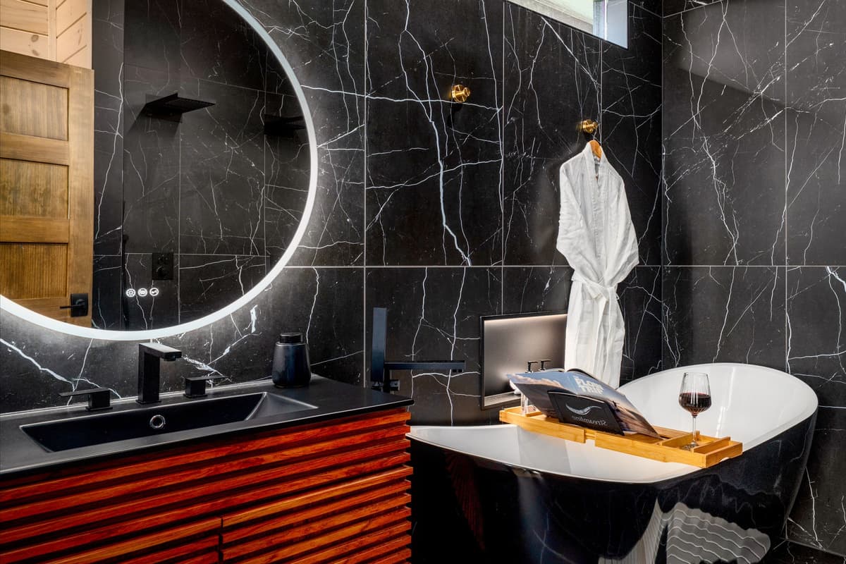 The bathroom features a beautiful freestanding soaking tub that adds a touch of comfort and style.