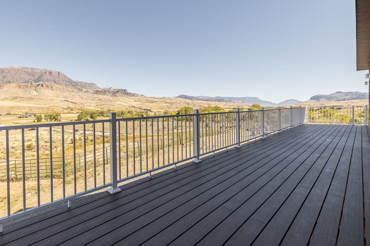 Step onto the balcony and take in the breathtaking panoramic views surrounding this Cody, Wyoming cabin.