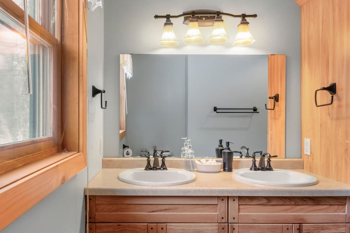 The upstairs bathroom provides a clean and convenient space for guests to freshen up during their stay.