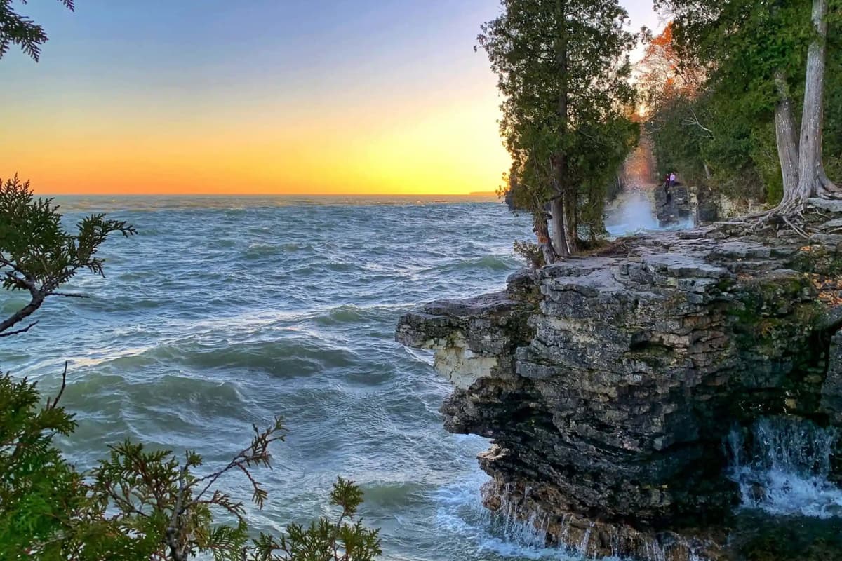 Explore the natural beauty of Cave Point County Park, where dramatic limestone cliffs meet the blue waters of Lake Michigan