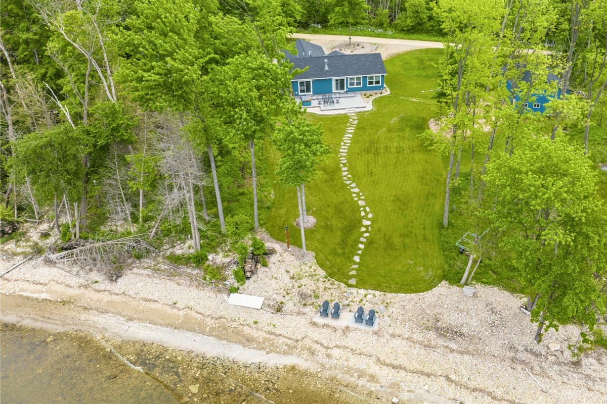 Discover bliss by the lake in this serene vacation rental. With the water just steps away, relaxation and adventure are yours to enjoy. Welcome to your lakeside escape.
