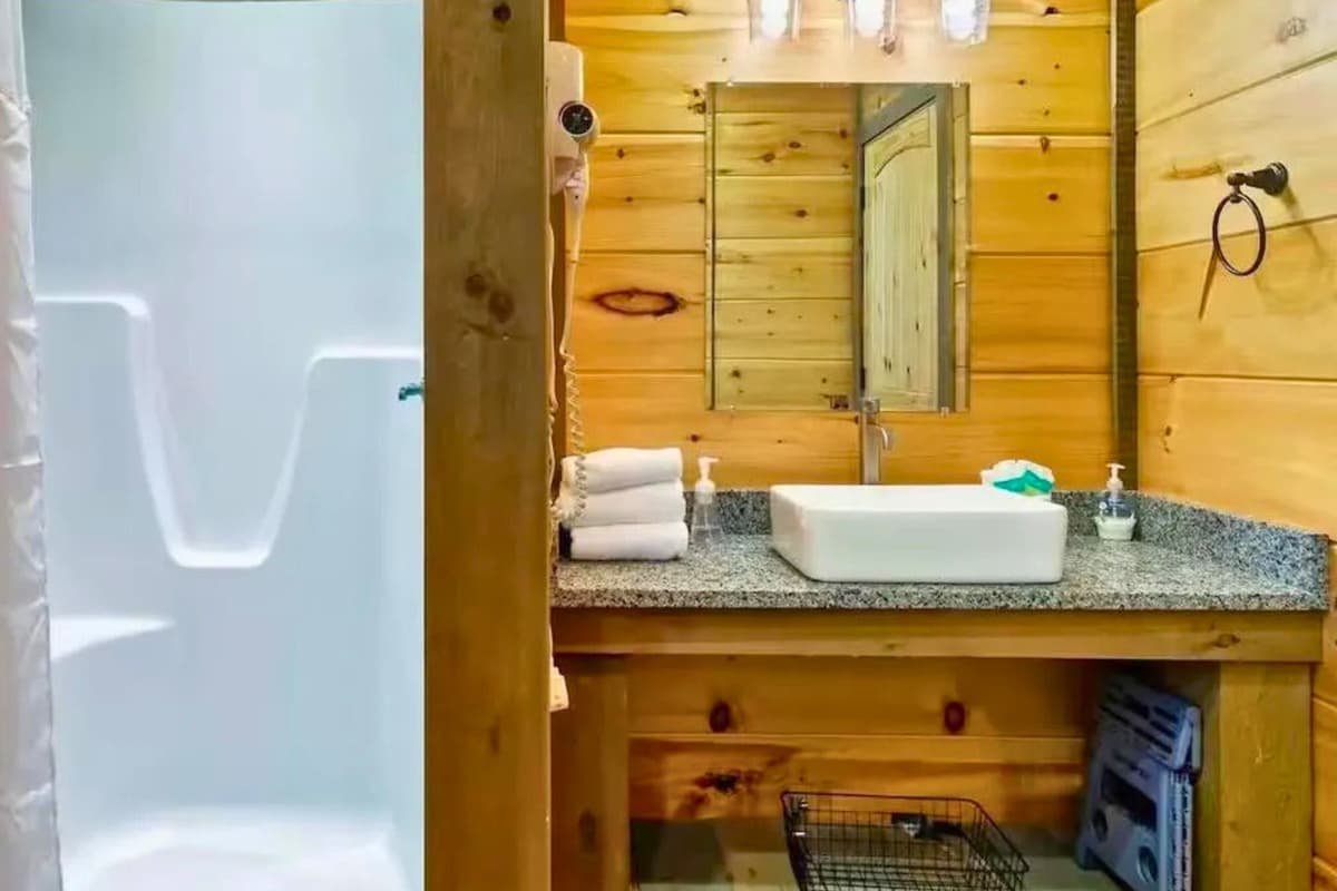 Freshen up in the full bathroom featuring a spacious walk-in shower.