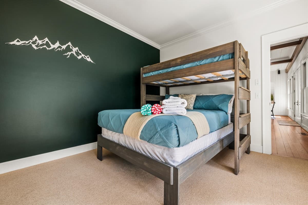 Bunk Bed in Bedroom 2 with Dark Green Accent Wall and Mountain Decal