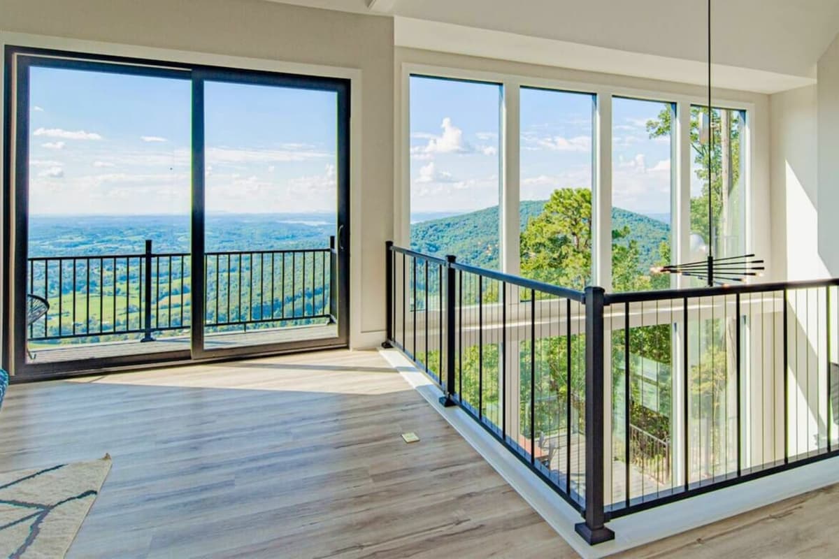 The upstairs hallway offers beautiful views as you make your way between the bedrooms and shared spaces.
