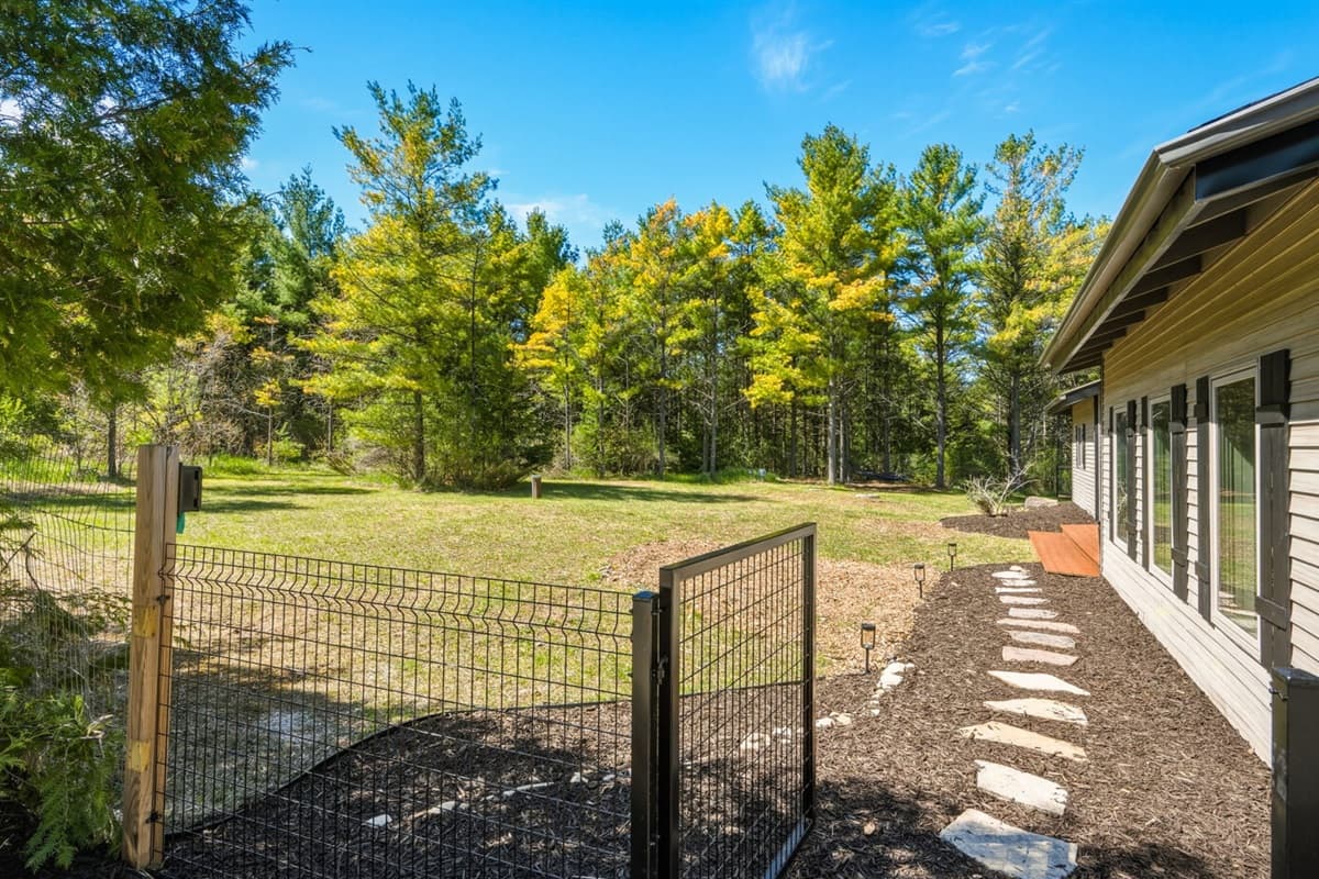 Fully fenced front yard offering added privacy, safety, and peace of mind during your stay.