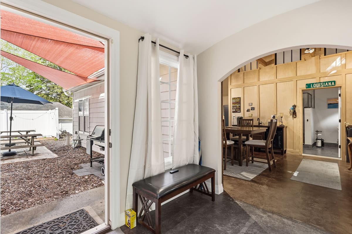 A welcoming hallway leads the way to the private suite, creating a comfortable transition between the shared spaces and the bedroom retreat.