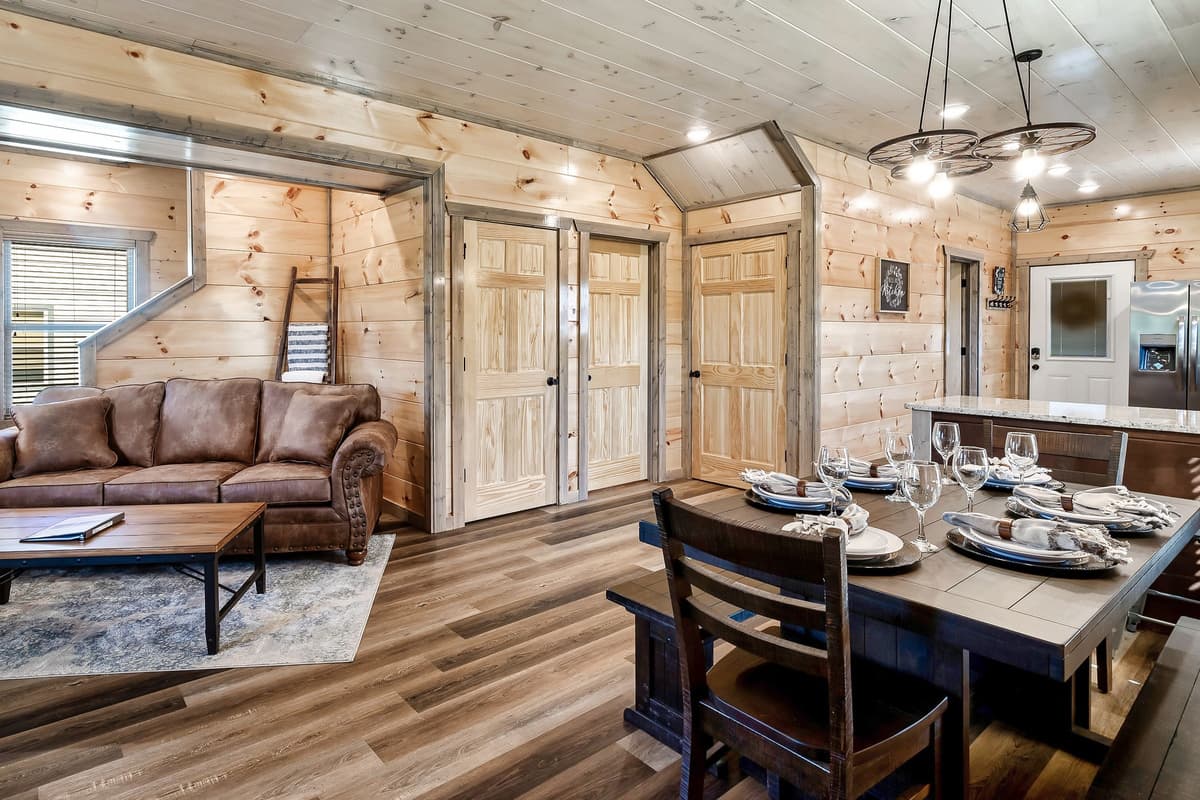 Walk into a Sevierville cabin where the living and dining spaces come together in one inviting, open-concept setting.