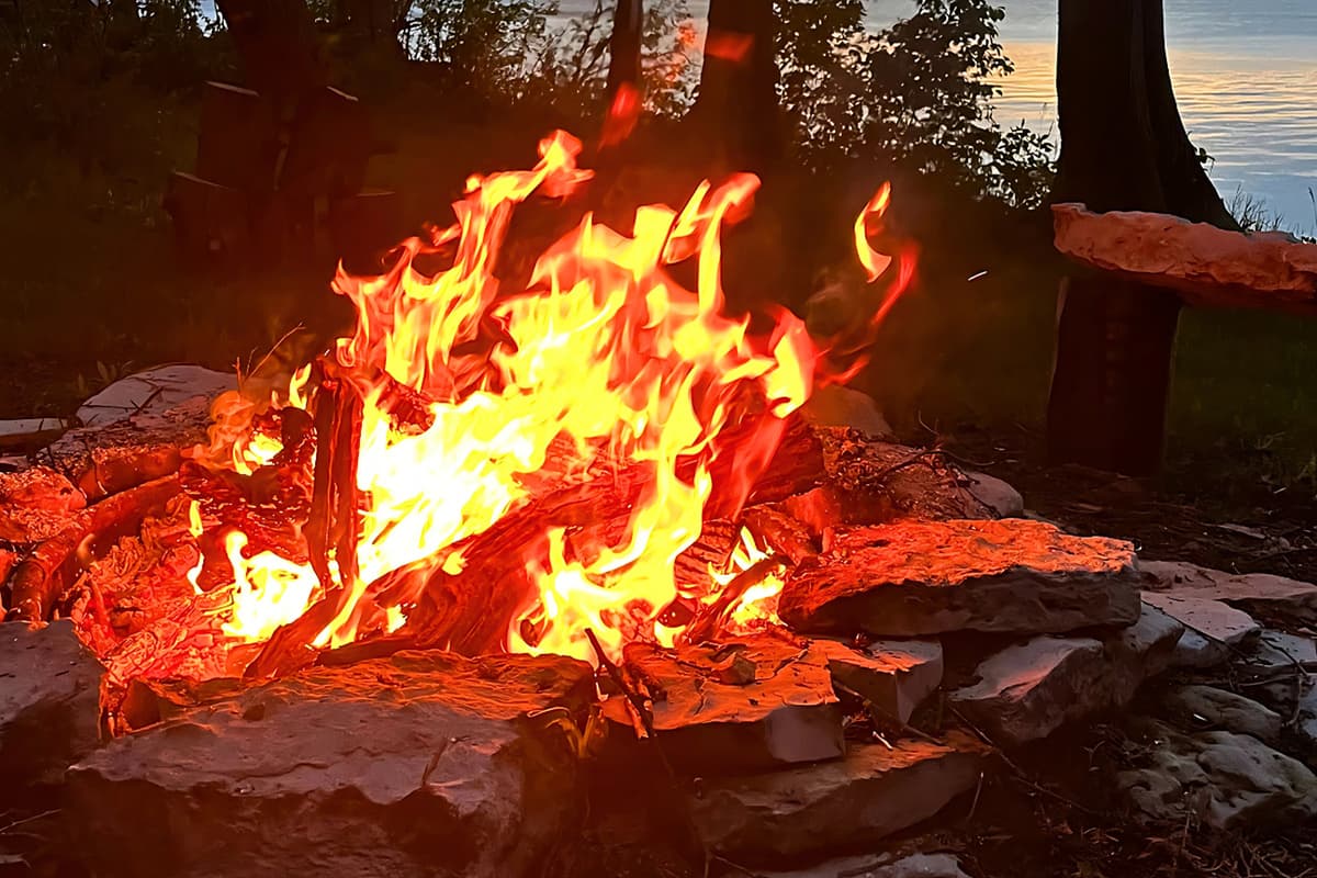 The fire pit creates a welcoming atmosphere for relaxing after a day of exploring. Settle into the nearby seating and take in the beautiful outdoor setting as the evening winds down.