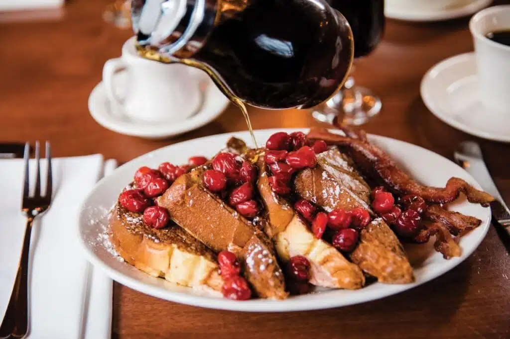 Warm winter meal served at a cozy Door County restaurant with candles and comfort food