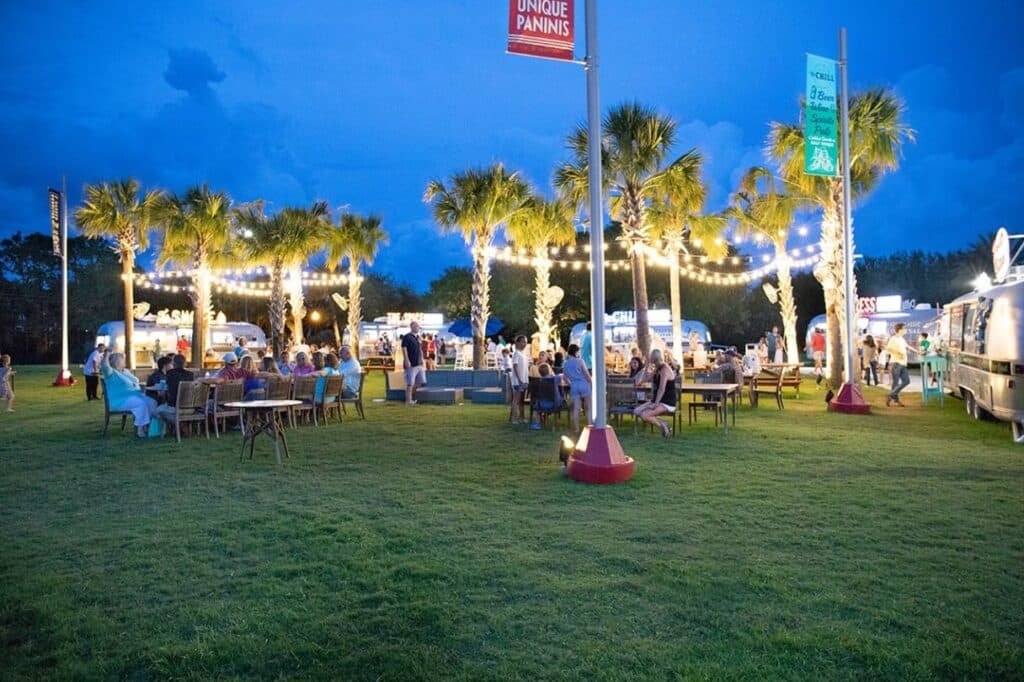 Family eating seafood together at a relaxed Gulf Shores restaurant near the beach