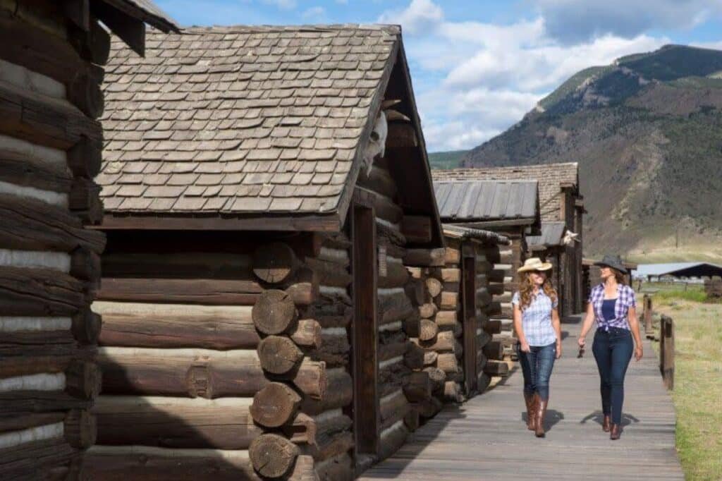Street scene in Cody Wyoming with western style buildings and mountain backdrop
