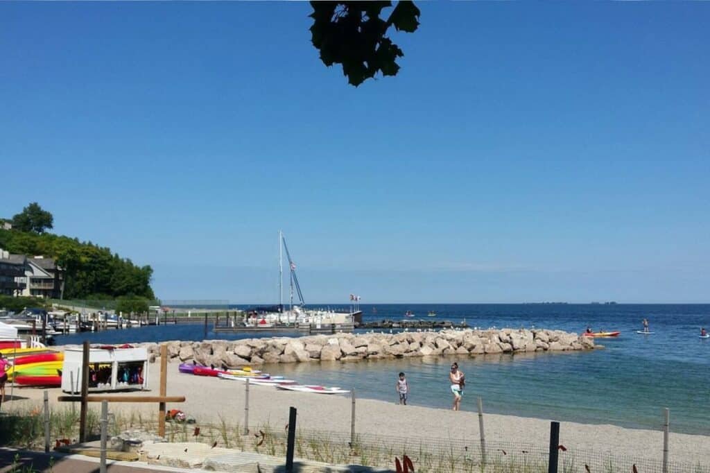 Waterfront view of Sister Bay Wisconsin with boats, docks and lakeside buildings