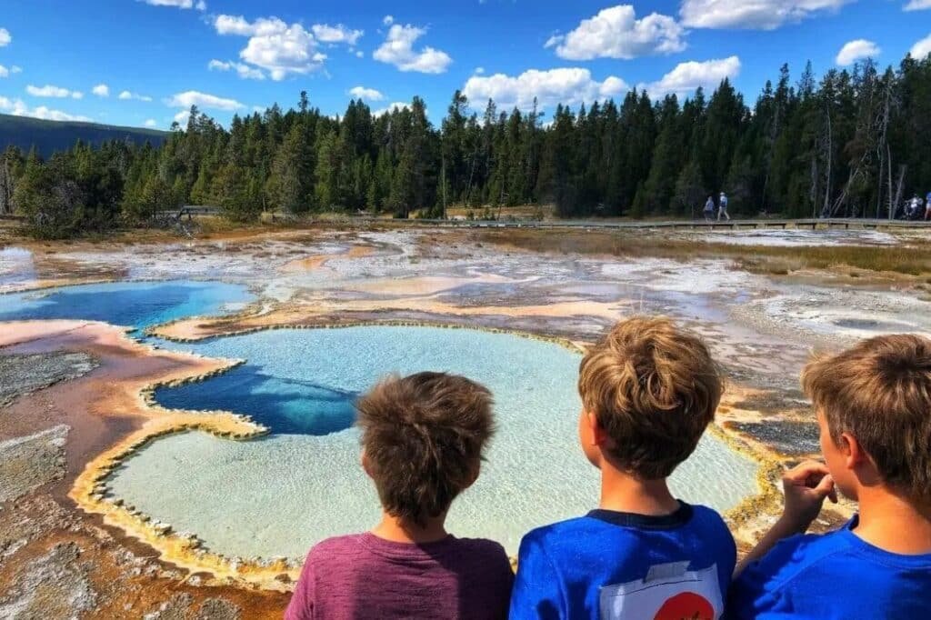 Scenic Yellowstone National Park view with geysers steam and colorful hot springs