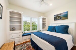 Comfortable queen bedroom with serene outdoor views.
