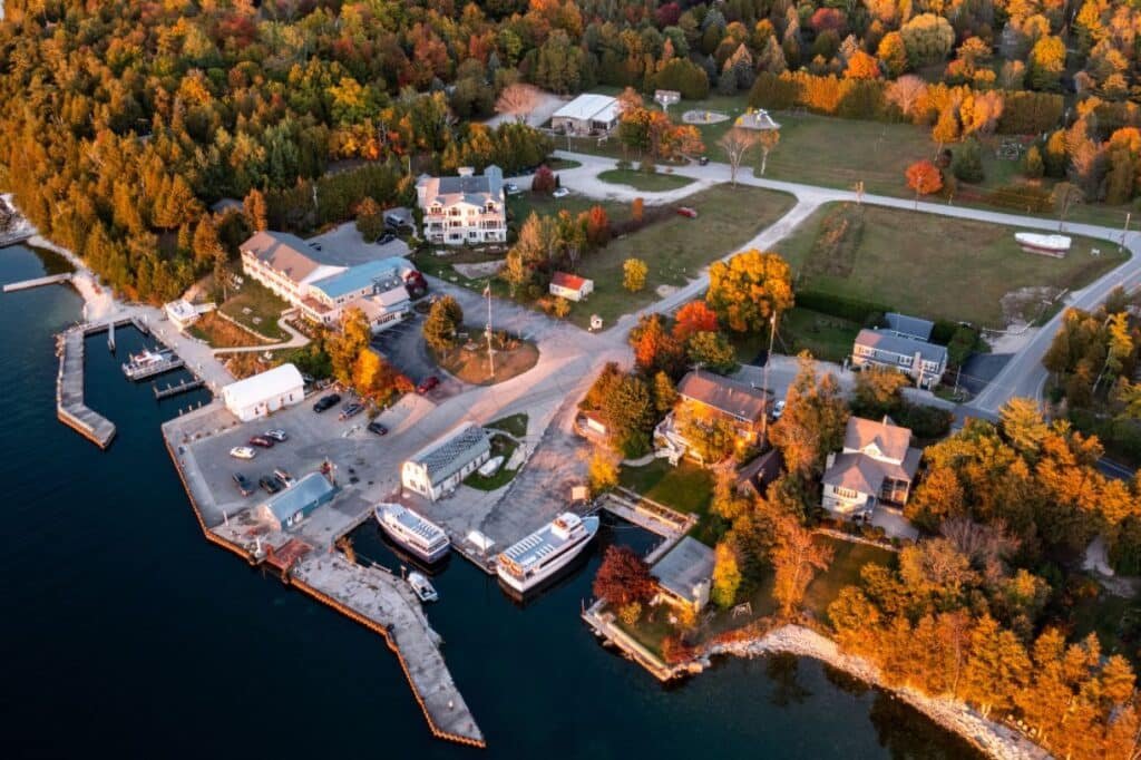 Eagle Bluff Lighthouse in Peninsula State Park with shoreline and trees