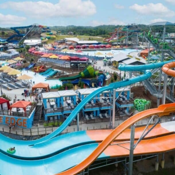 Guests riding water slides and floating in the wave pool at Soaky Mountain Waterpark