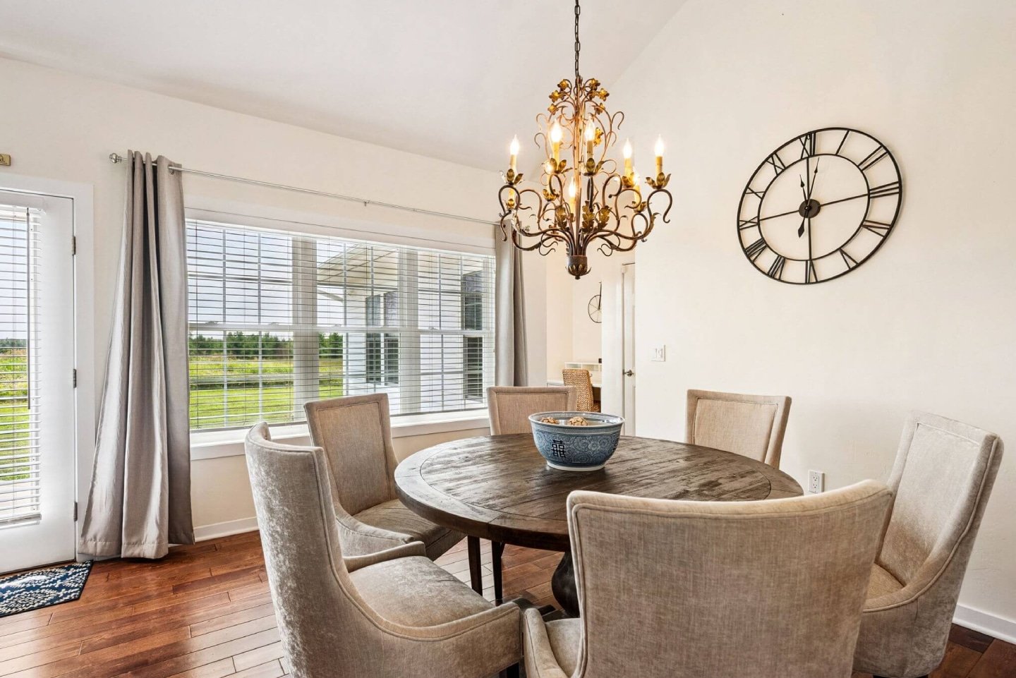Large windows fill the dining space with light and views.