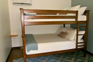 Two Queen beds set up as bunk beds