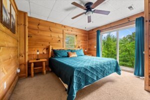 Spacious king bedroom with large sliding doors and plenty of natural light.