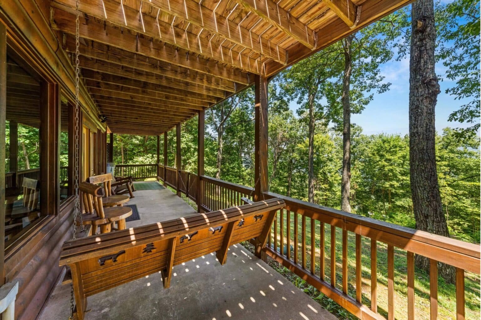 Find your slice of serenity on our cabin's porch, where breathtaking views and abundant seating create the perfect harmony of relaxation and nature's beauty.