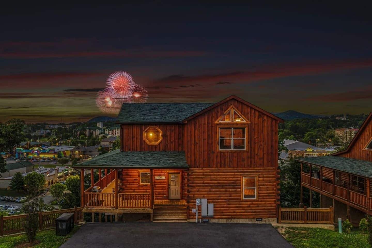 Nestled in the heart of Pigeon Forge, our cabin glows under the starry night, offering a peaceful mountain retreat.