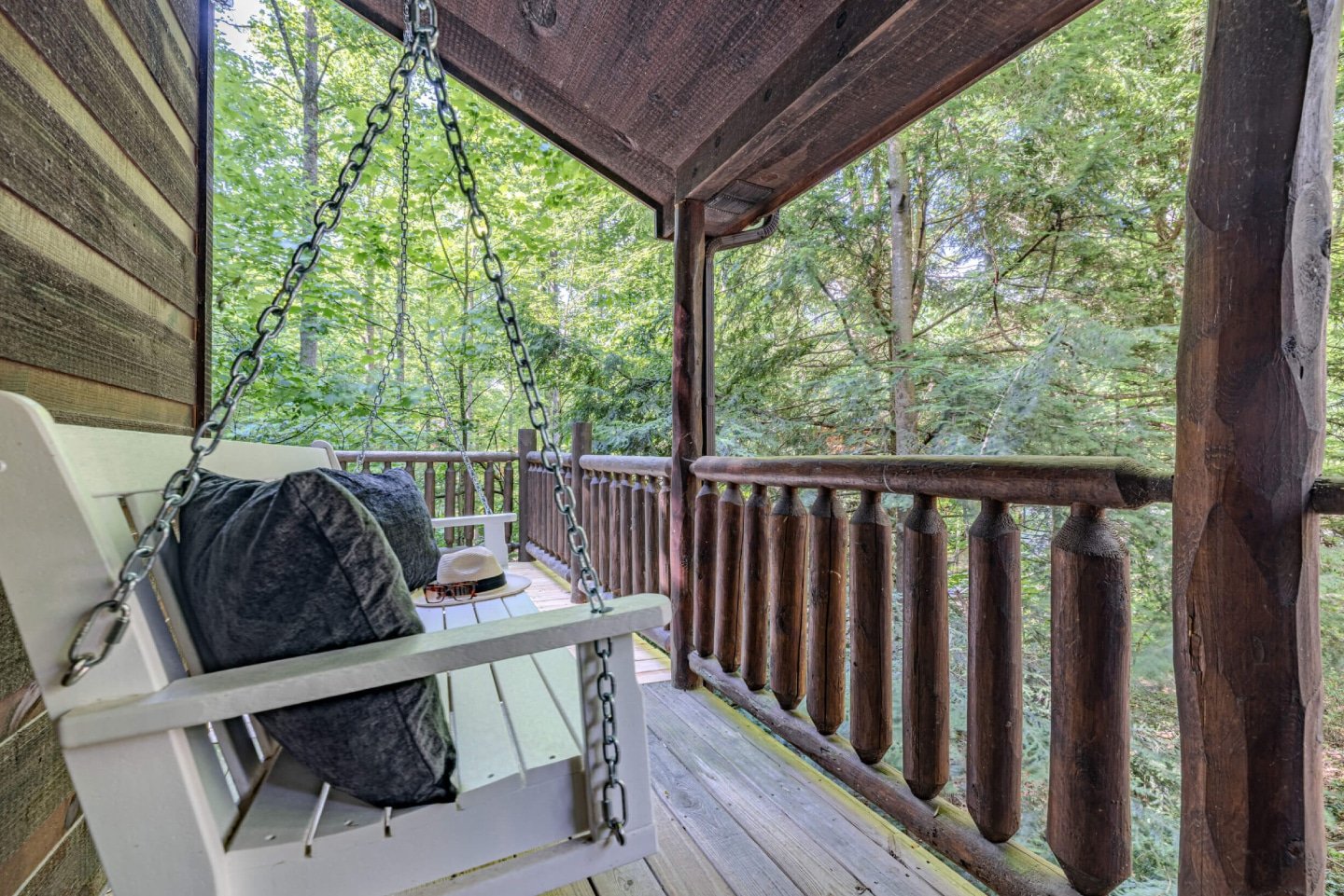 Enjoy a relaxing moment on the cozy porch swing