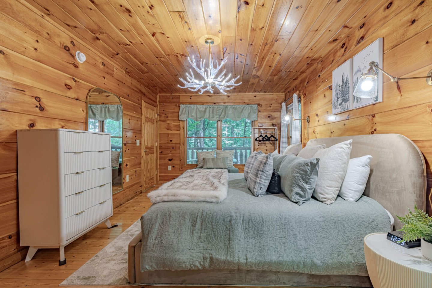 This charming bedroom offers a plush queen-sized bed