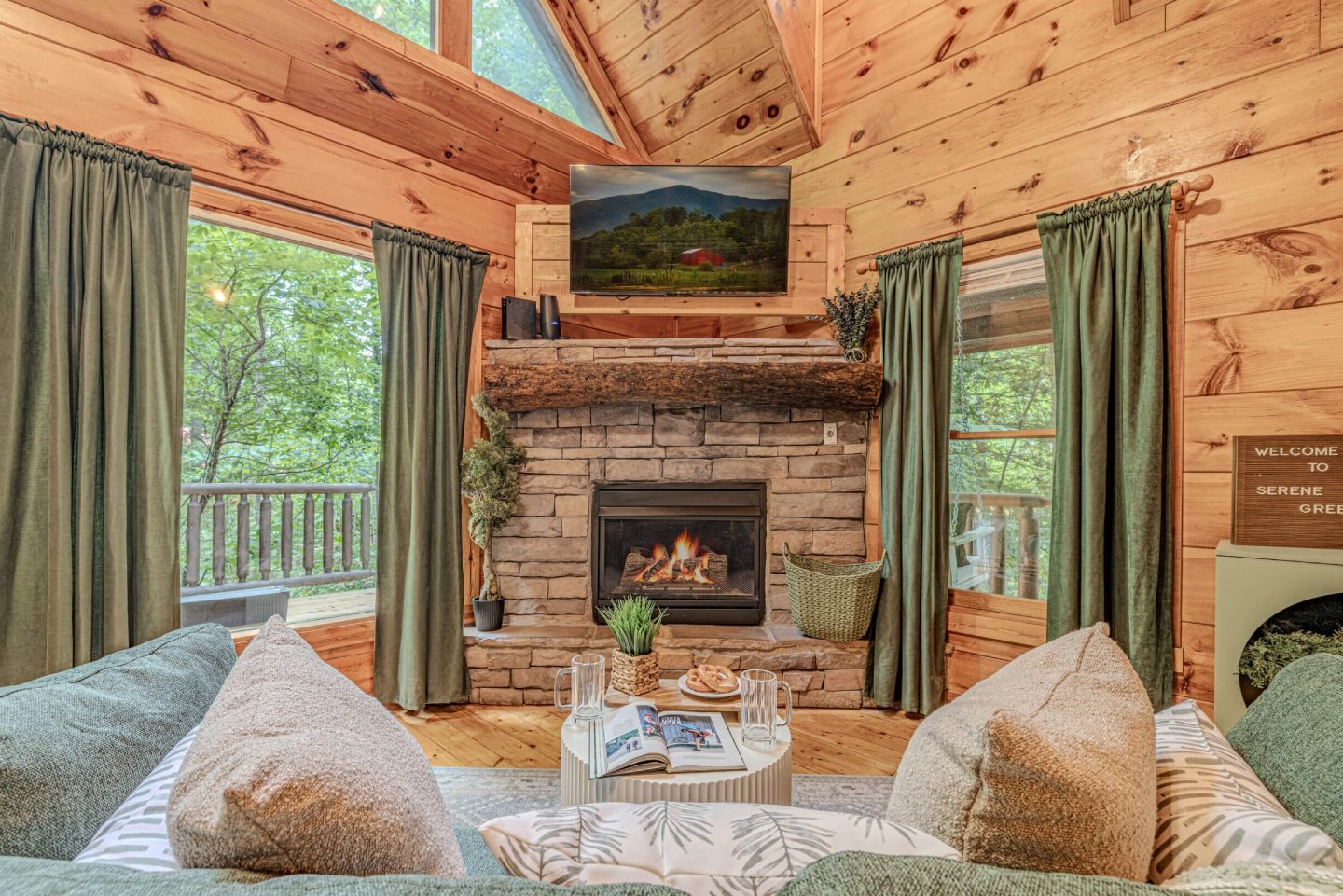 Curl up by the inviting stone fireplace in this cozy living room