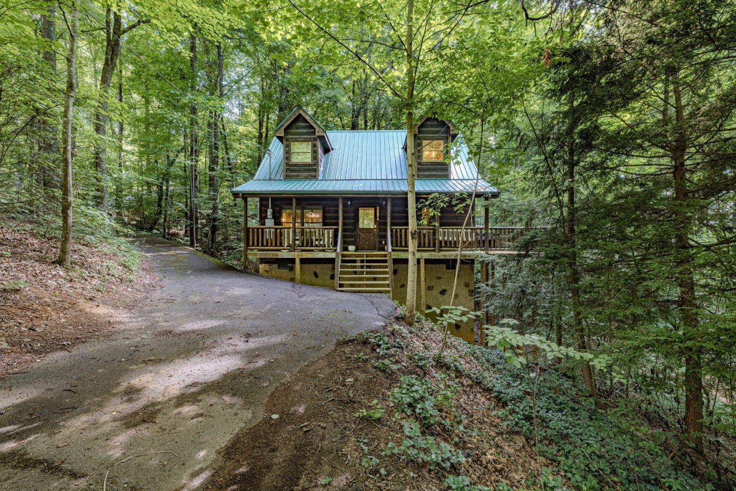 The rustic cabin sits gracefully amidst a lush forest